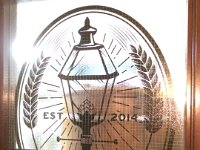 Waller St Brewing  Logo in reverse cut vinyl, installed on the inside of the window to capture the texture of the window